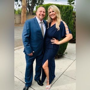 Beautiful navy dress with rhinestones on sleeve. Very flattering and comfortable